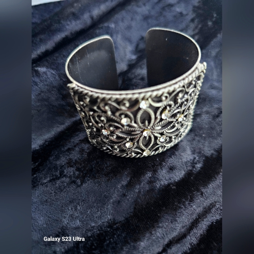 Ladies Silver Tone Cuff Bracelet...3 and 3/4 across.